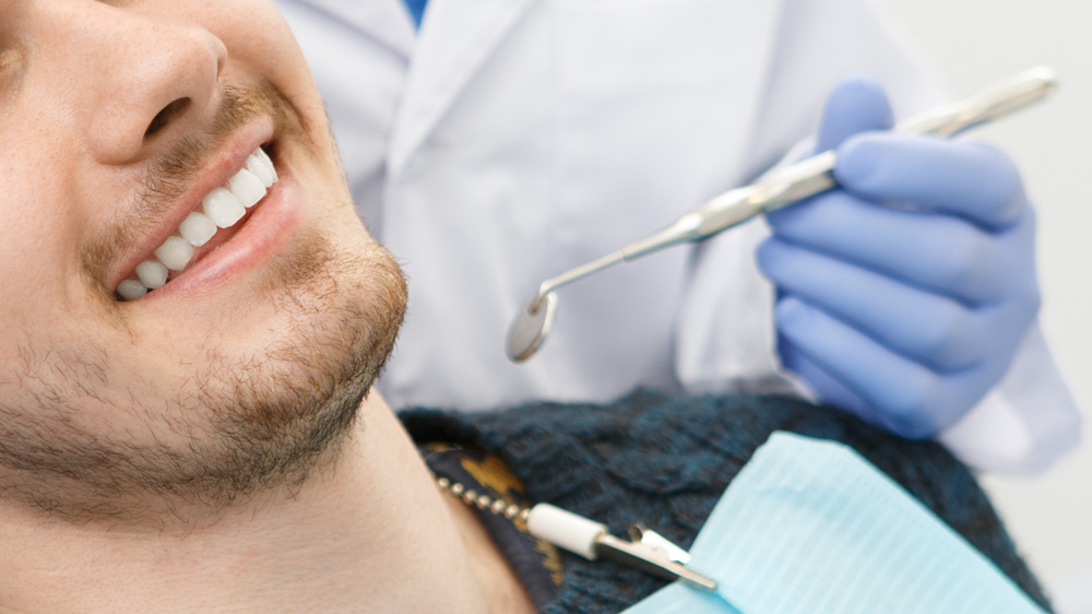 Patient visiting dentist for regular cleaning